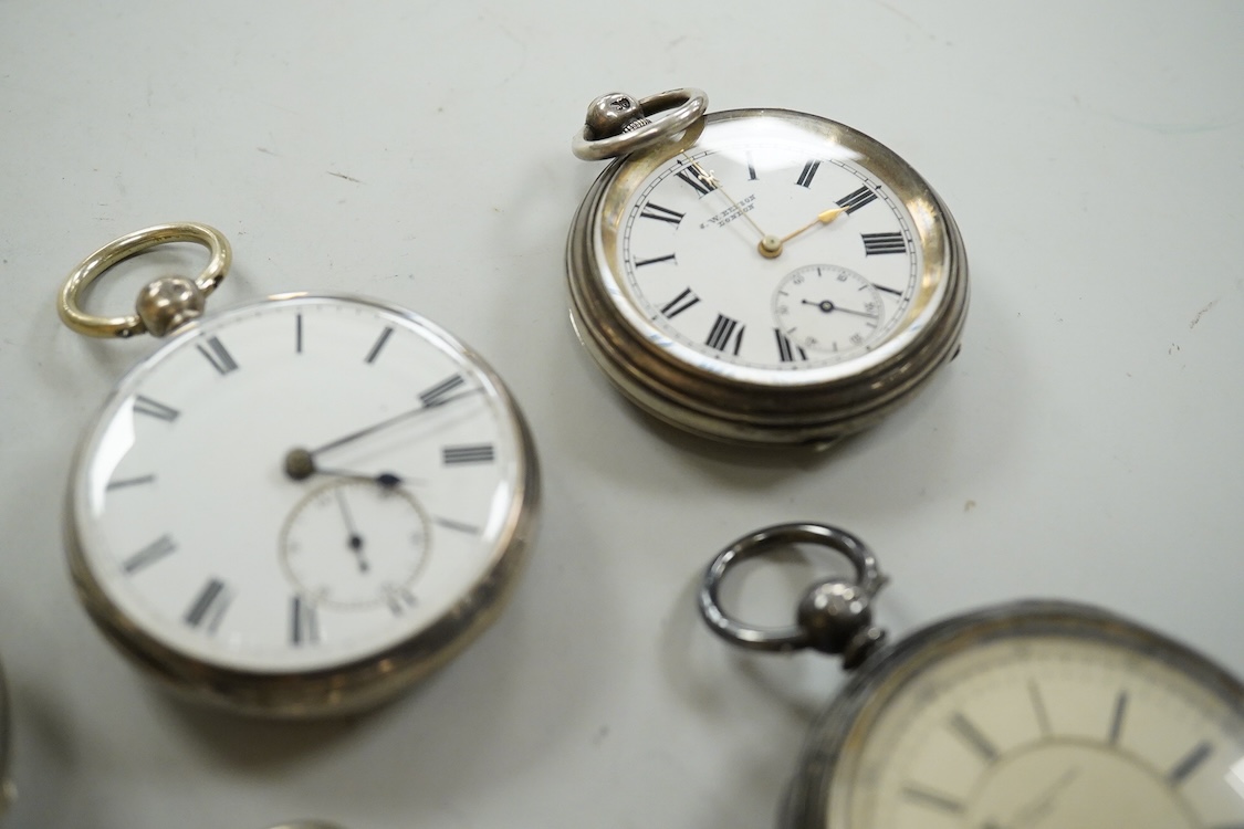 Seven assorted mainly early 20th century silver open faced pocket watches including a chronograph by William Williams of Bury, case diameter 53mm and one other silver pocket watch case(no movement).